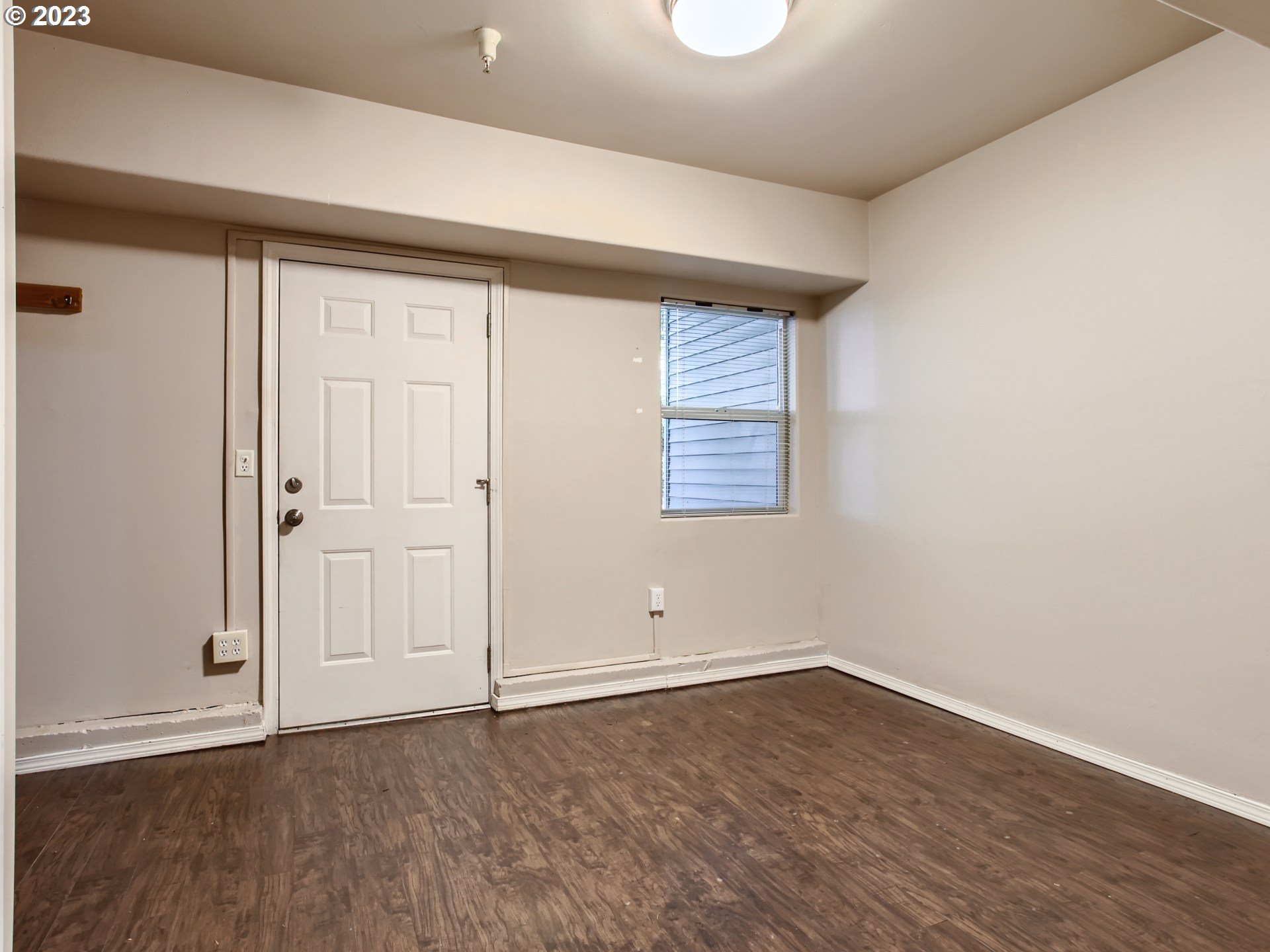 14140 Southwest Barrows Road, Unit 2 Portland, OR 97223 - Photo 22 of 30 an empty room with wooden floor and windows