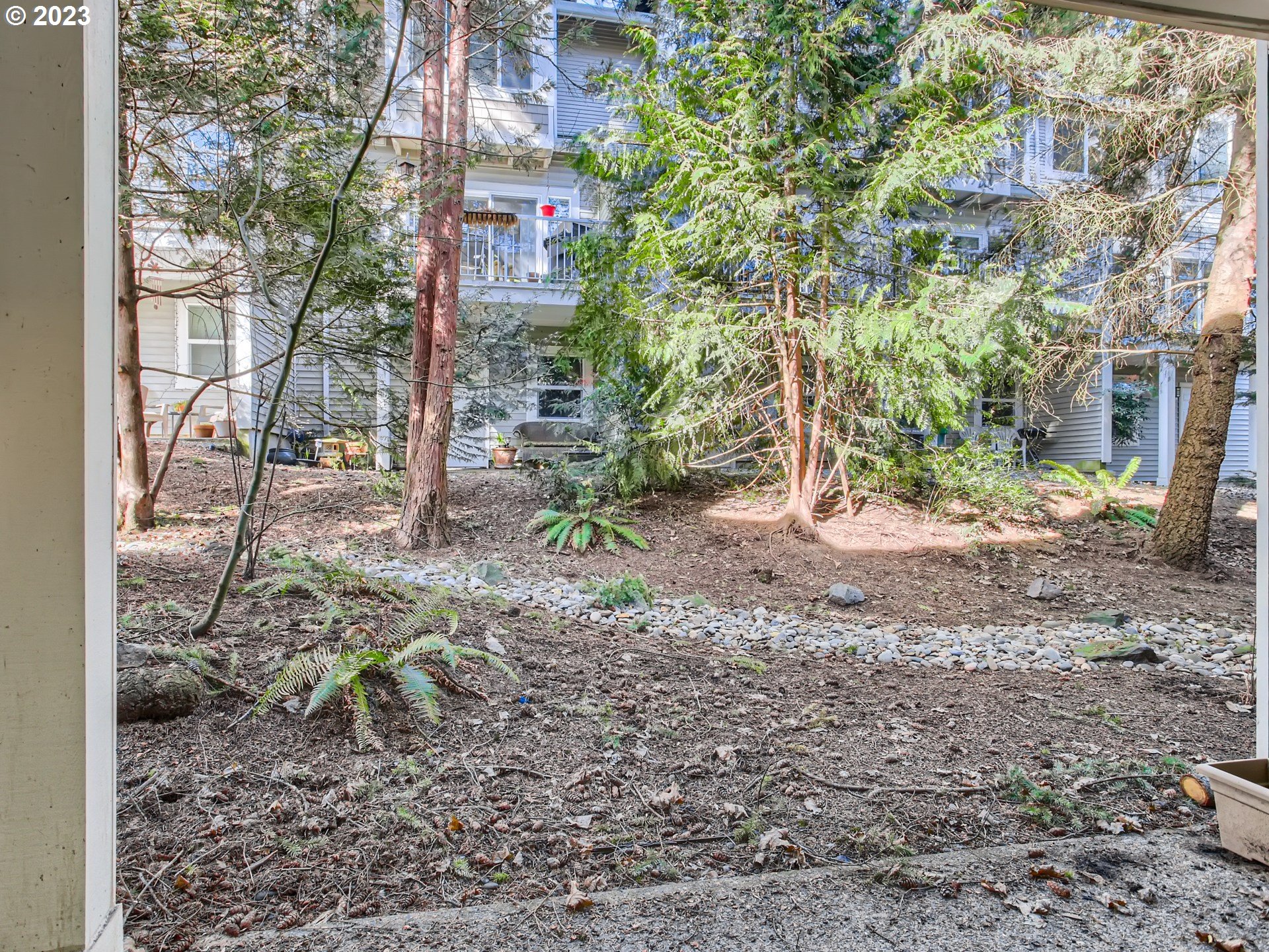 14140 Southwest Barrows Road, Unit 2 Portland, OR 97223 - Photo 25 of 30 a backyard of a house with lots of green space