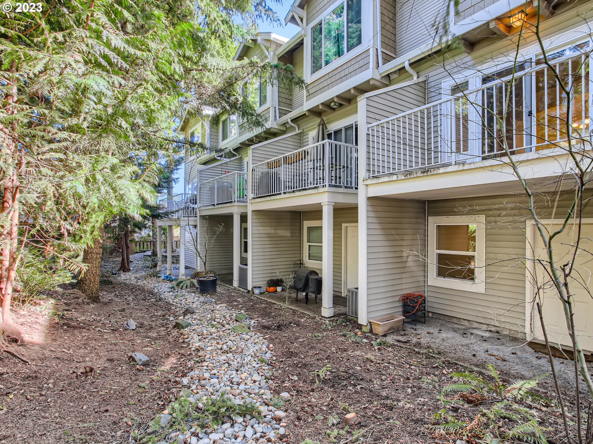14140 Southwest Barrows Road, Unit 2 Portland, OR 97223 - Photo 26 of 30 a front view of a house with garden