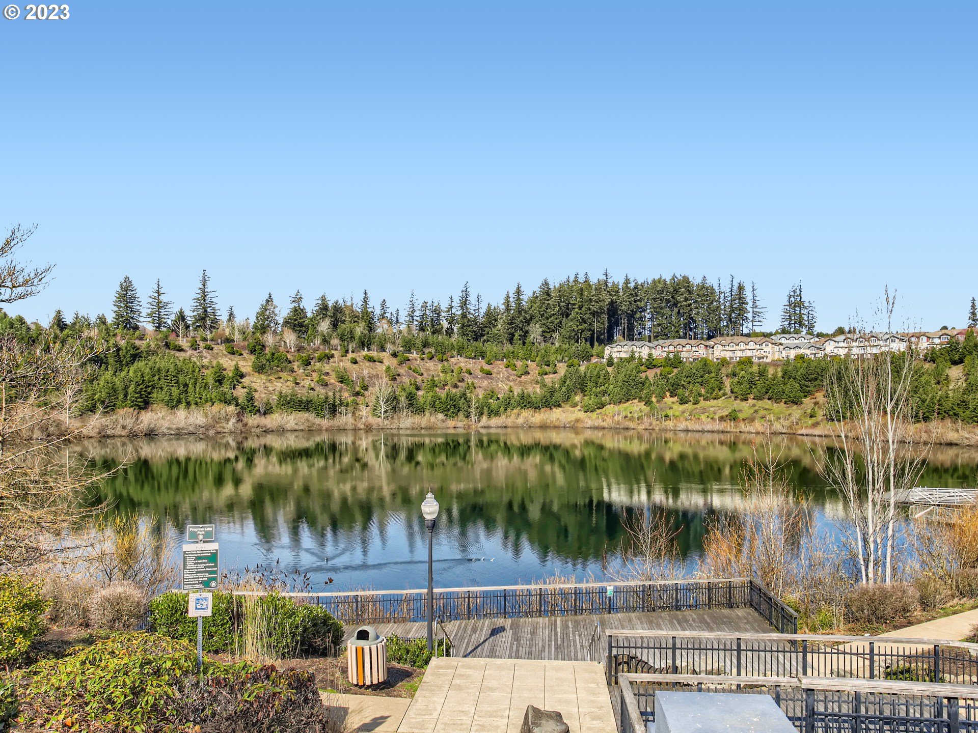 14140 Southwest Barrows Road, Unit 2 Portland, OR 97223 - Photo 30 of 30 a view of a lake with a yard and mountain view