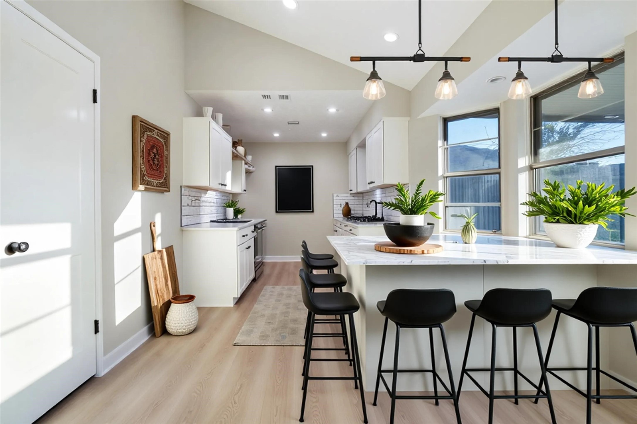 11822 South Perry Avenue Houston, TX 77071 - Photo 7 of 23 a kitchen with stainless steel appliances kitchen island granite countertop a dining table chairs and white cabinets