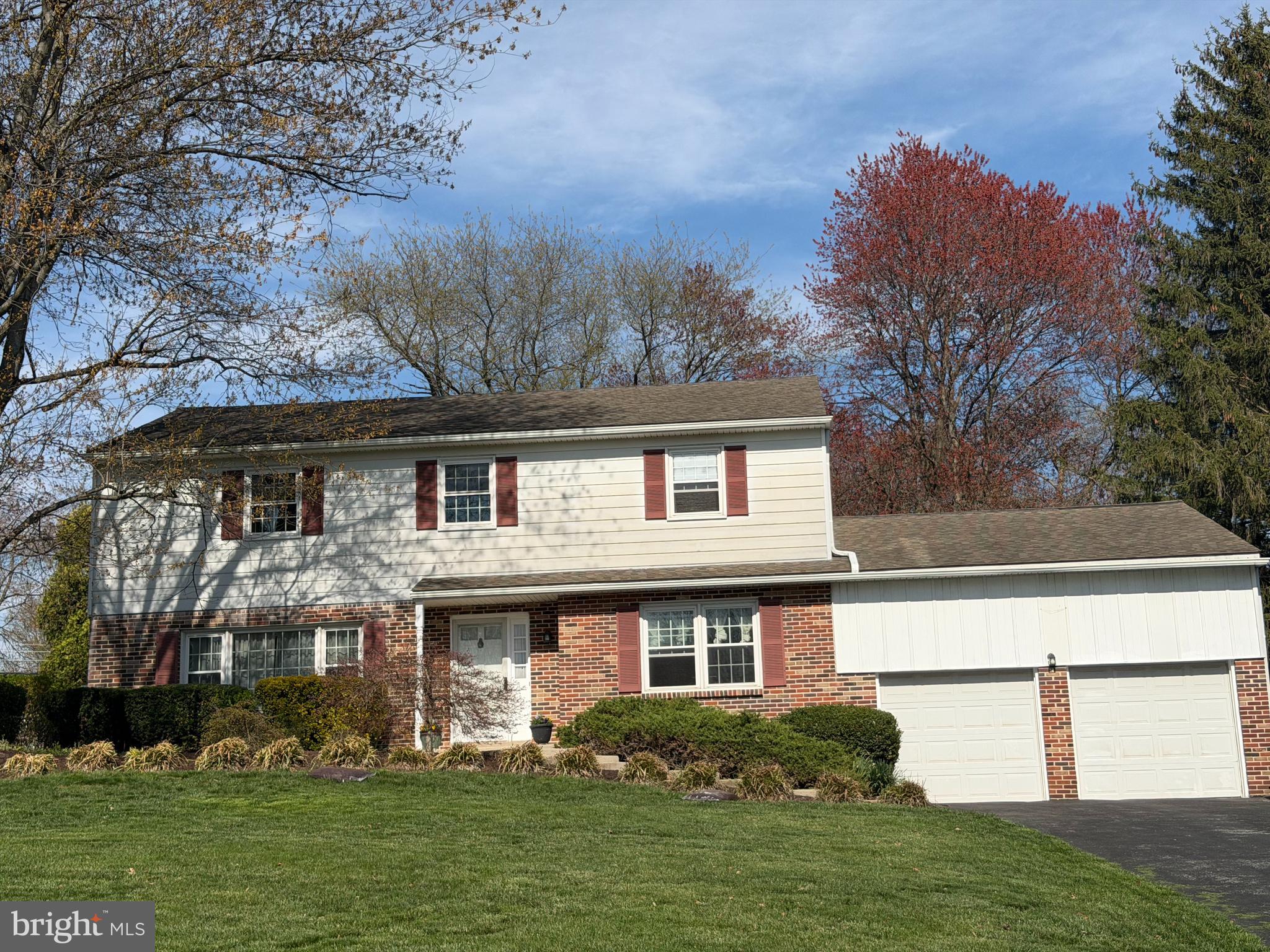 1231 Gail Road West Chester, PA 19380 - Photo 2 of 49 a front view of a house with a garden and plants