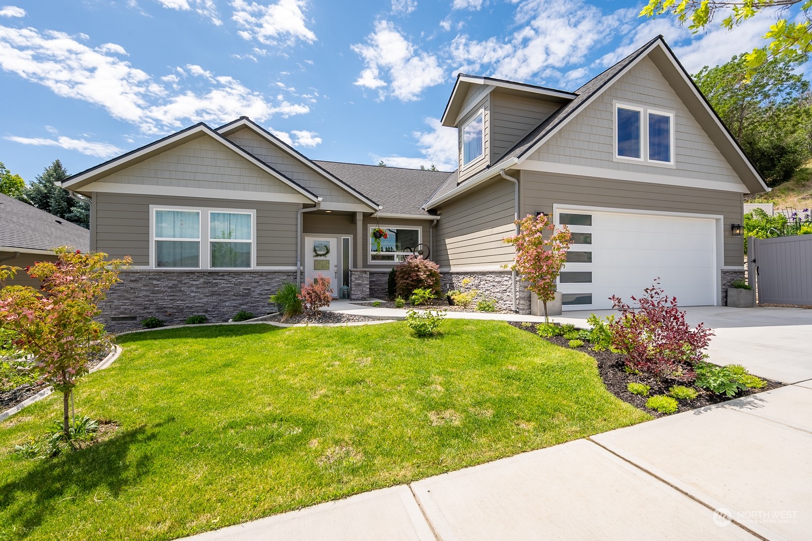 a front view of house with yard and green space