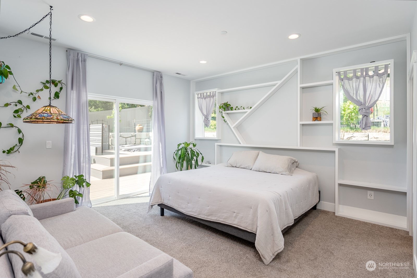 949 Spring Mountain Drive Wenatchee, WA 98801 - Photo 12 of 33 a bed sitting in a spacious bedroom next to a window