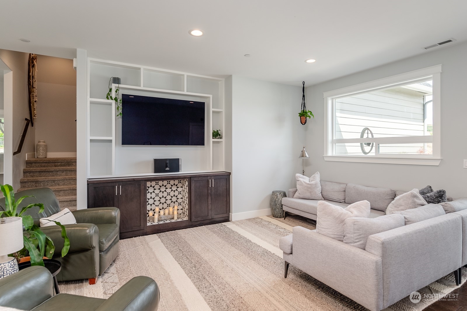 949 Spring Mountain Drive Wenatchee, WA 98801 - Photo 4 of 33 a living room with furniture and a flat screen tv