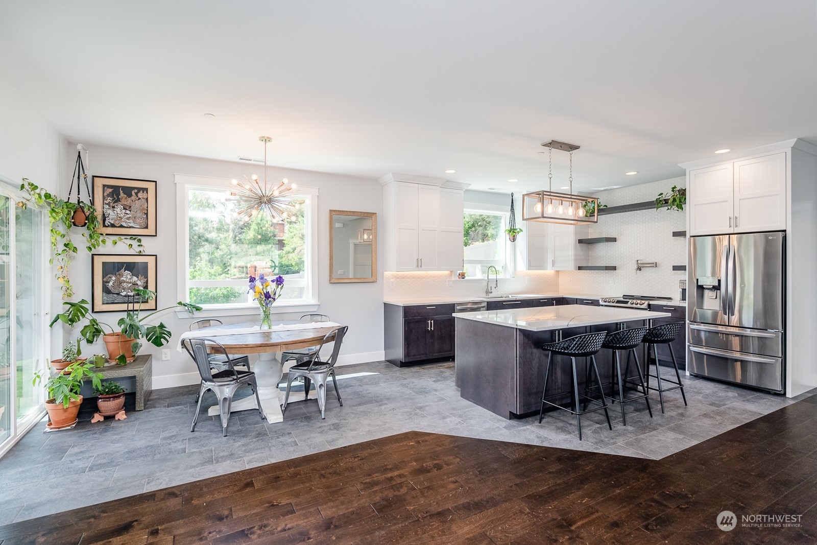 949 Spring Mountain Drive Wenatchee, WA 98801 - Photo 6 of 33 a kitchen with a dining table chairs and refrigerator