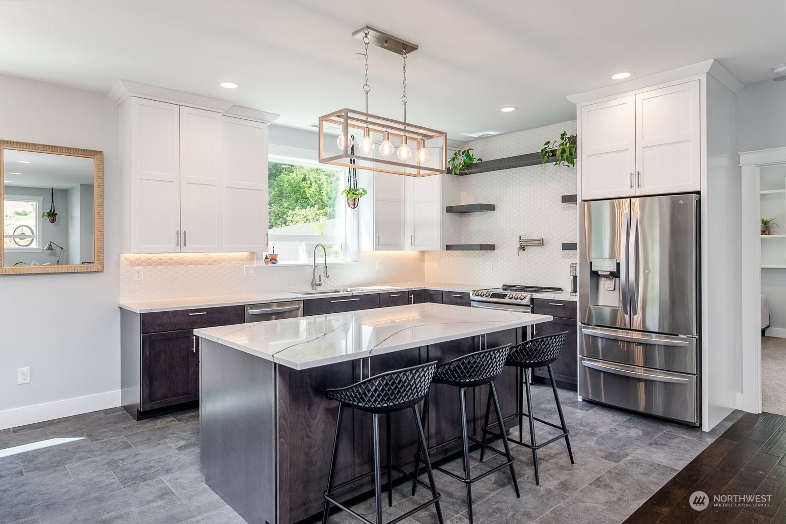 949 Spring Mountain Drive Wenatchee, WA 98801 - Photo 7 of 33 a kitchen with stainless steel appliances granite countertop a sink a stove a refrigerator and island