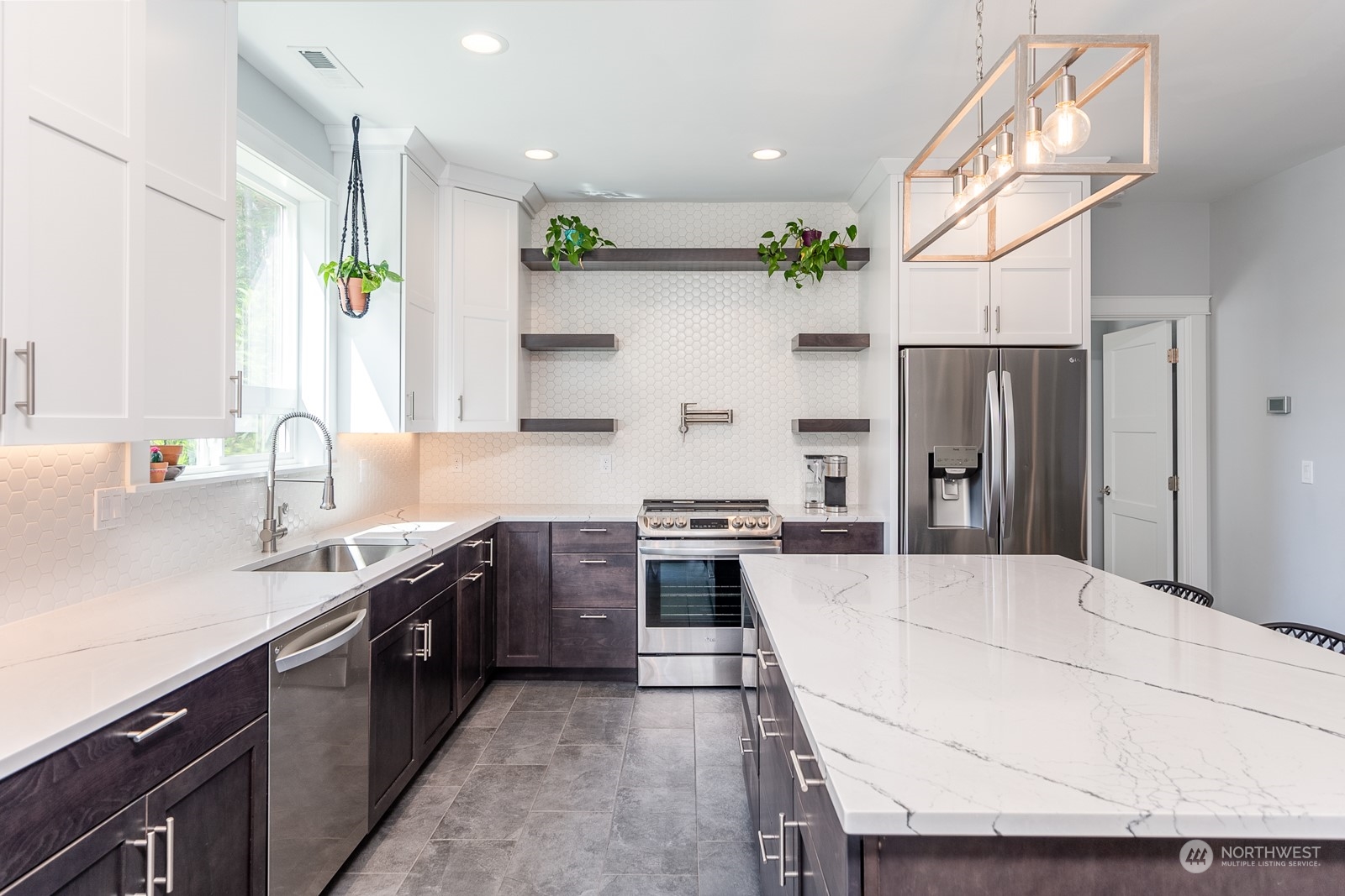 949 Spring Mountain Drive Wenatchee, WA 98801 - Photo 8 of 33 a open kitchen with stainless steel appliances granite countertop a sink stove and refrigerator