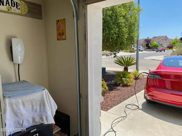 a storage room with lots of white furniture
