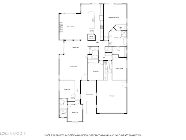 a bedroom with a bed and a potted plant