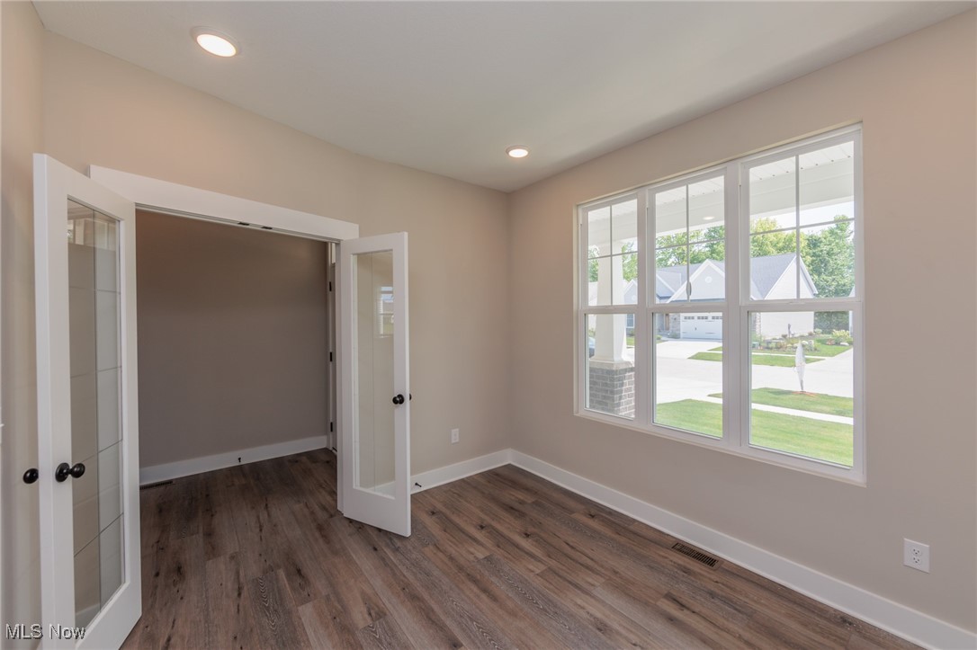 36458 Appian Way North Ridgeville, OH 44039 - Photo 3 of 37 Empty room featuring dark hardwood / wood-style flooring