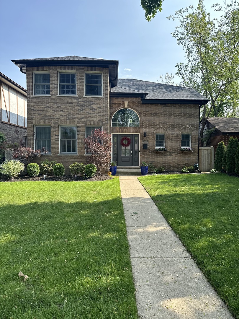 5327 Madison Street Skokie, IL 60077 - Photo 1 of 1 a front view of house with yard and green space
