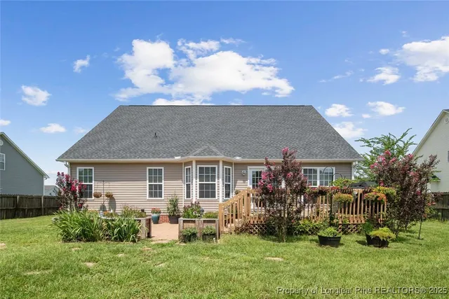 a view of house with yard and entertaining space