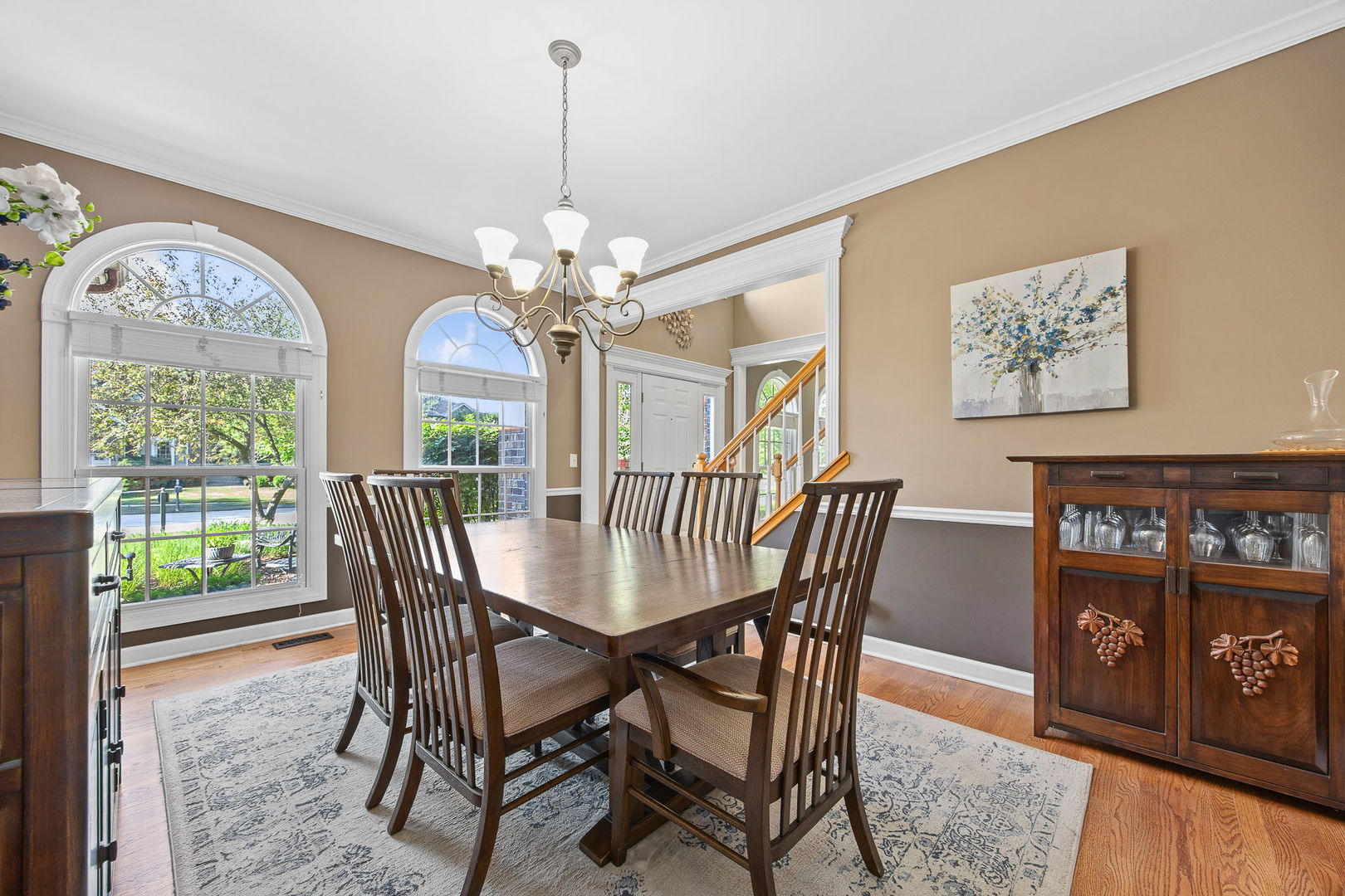 2816 Cordgrass Road Naperville, IL 60564 - Photo 16 of 49 a view of a dining room with furniture a chandelier and wooden floor