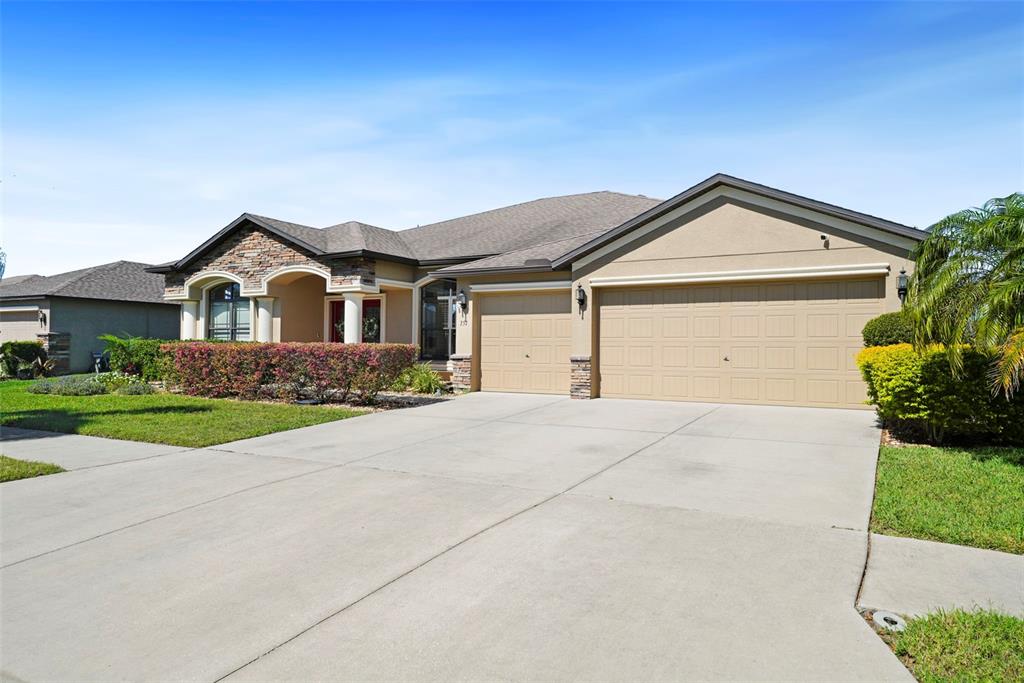 351 Hope Bay Loop Apollo Beach, FL 33572 - Photo 1 of 1 a front view of a house with a yard and garage