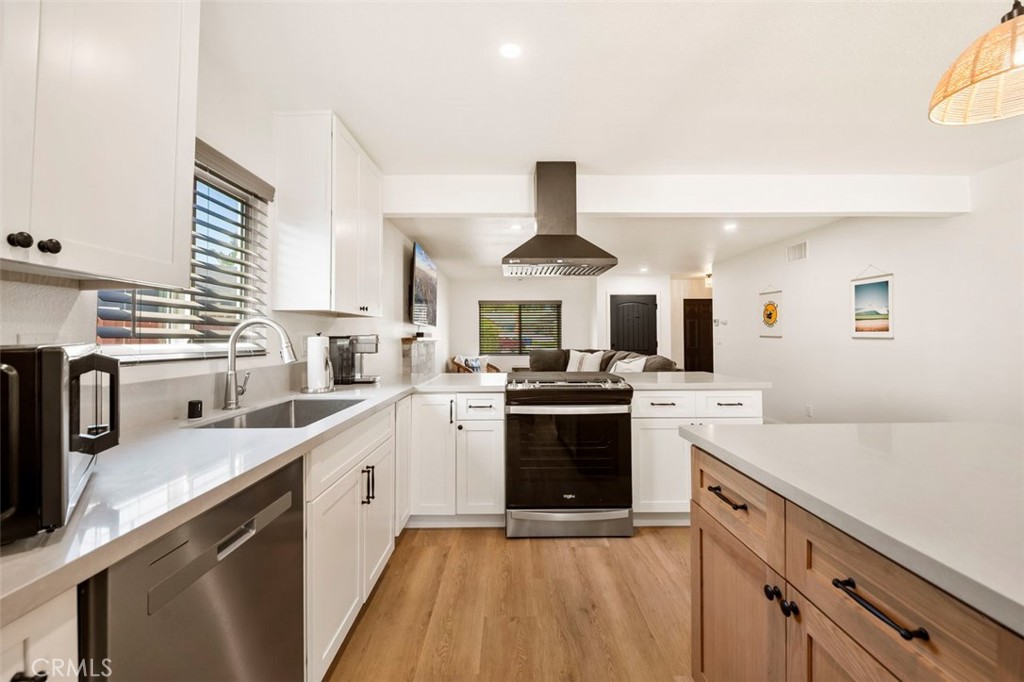 332 Cadillac Circle Oceanside, CA 92054 - Photo 12 of 31 a kitchen with stainless steel appliances a sink stove and refrigerator