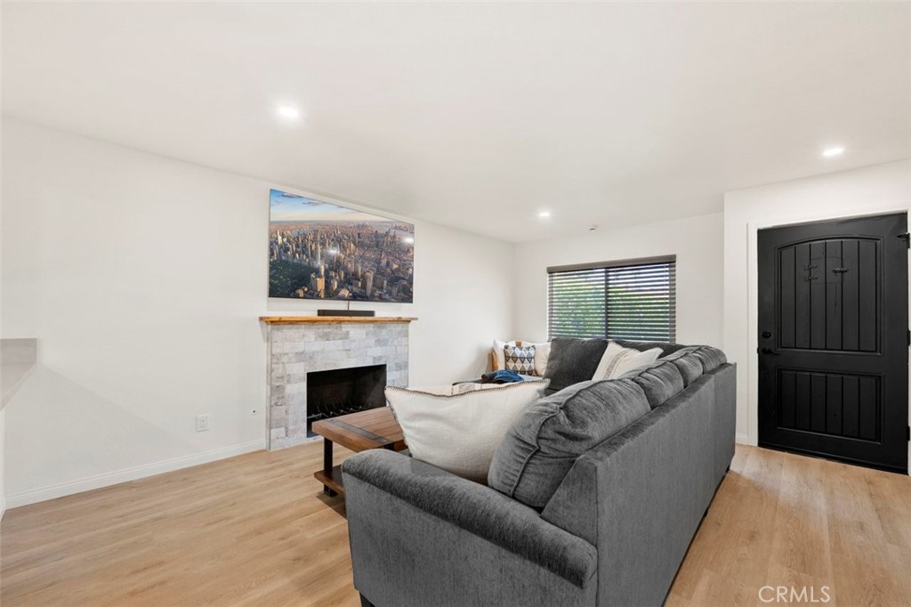332 Cadillac Circle Oceanside, CA 92054 - Photo 6 of 31 a living room with furniture and a fireplace