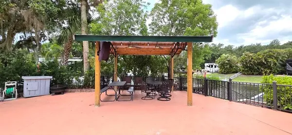 a view of a chairs and table in the patio