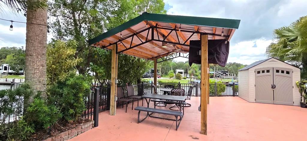 568 Waterway Drive River Ranch, FL 33867 - Photo 13 of 21 a view of a chairs and table in the patio