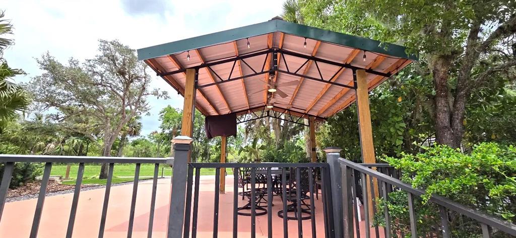 568 Waterway Drive River Ranch, FL 33867 - Photo 15 of 21 a view of a wooden fence with a flower garden