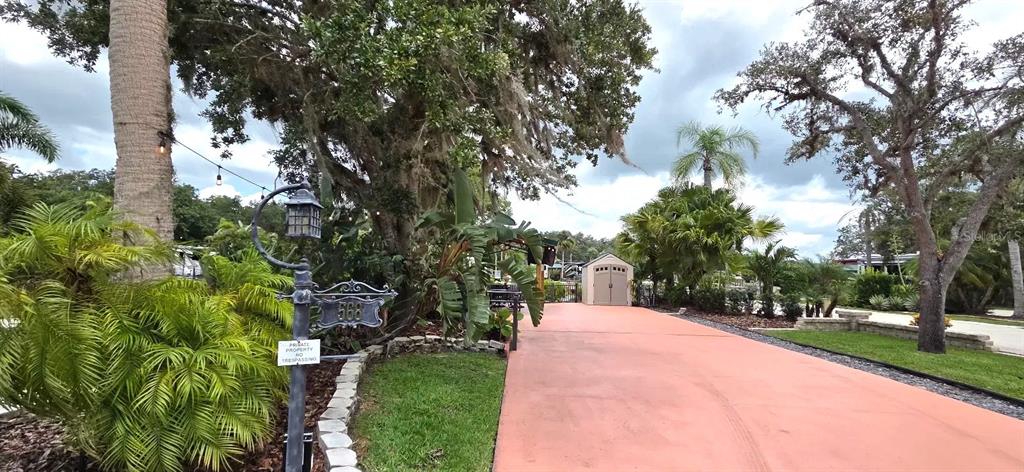 568 Waterway Drive River Ranch, FL 33867 - Photo 17 of 21 a view of street with large trees