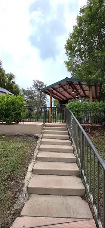 a view of a chairs and tables in patio