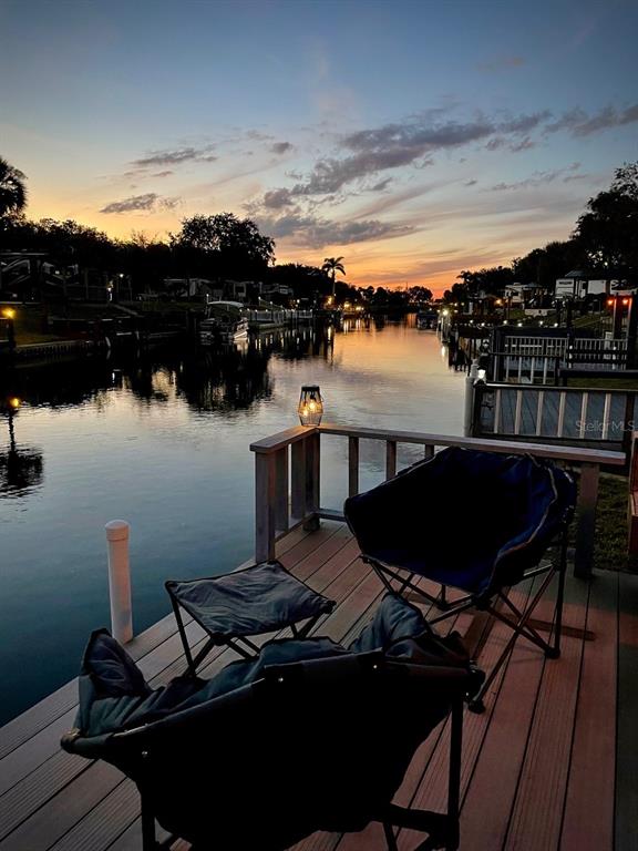 568 Waterway Drive River Ranch, FL 33867 - Photo 19 of 21 a view of a balcony with chairs and a table