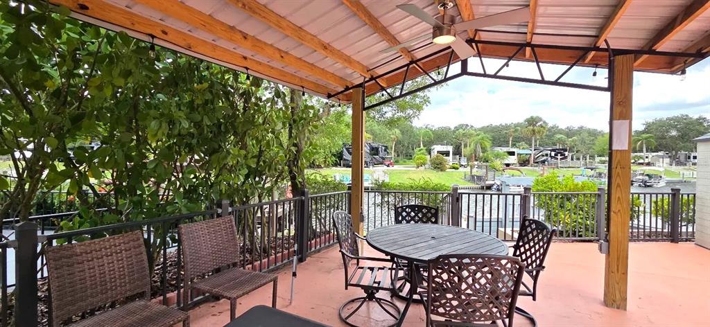 568 Waterway Drive River Ranch, FL 33867 - Photo 5 of 21 a view of a chairs and table in the patio