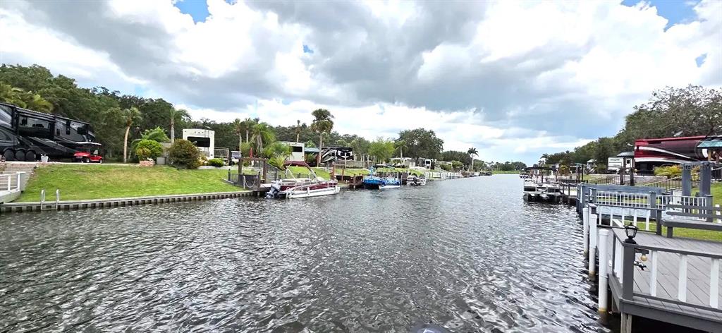 568 Waterway Drive River Ranch, FL 33867 - Photo 8 of 21 a view of a lake with houses