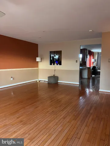 a large living room with furniture a rug and a fireplace