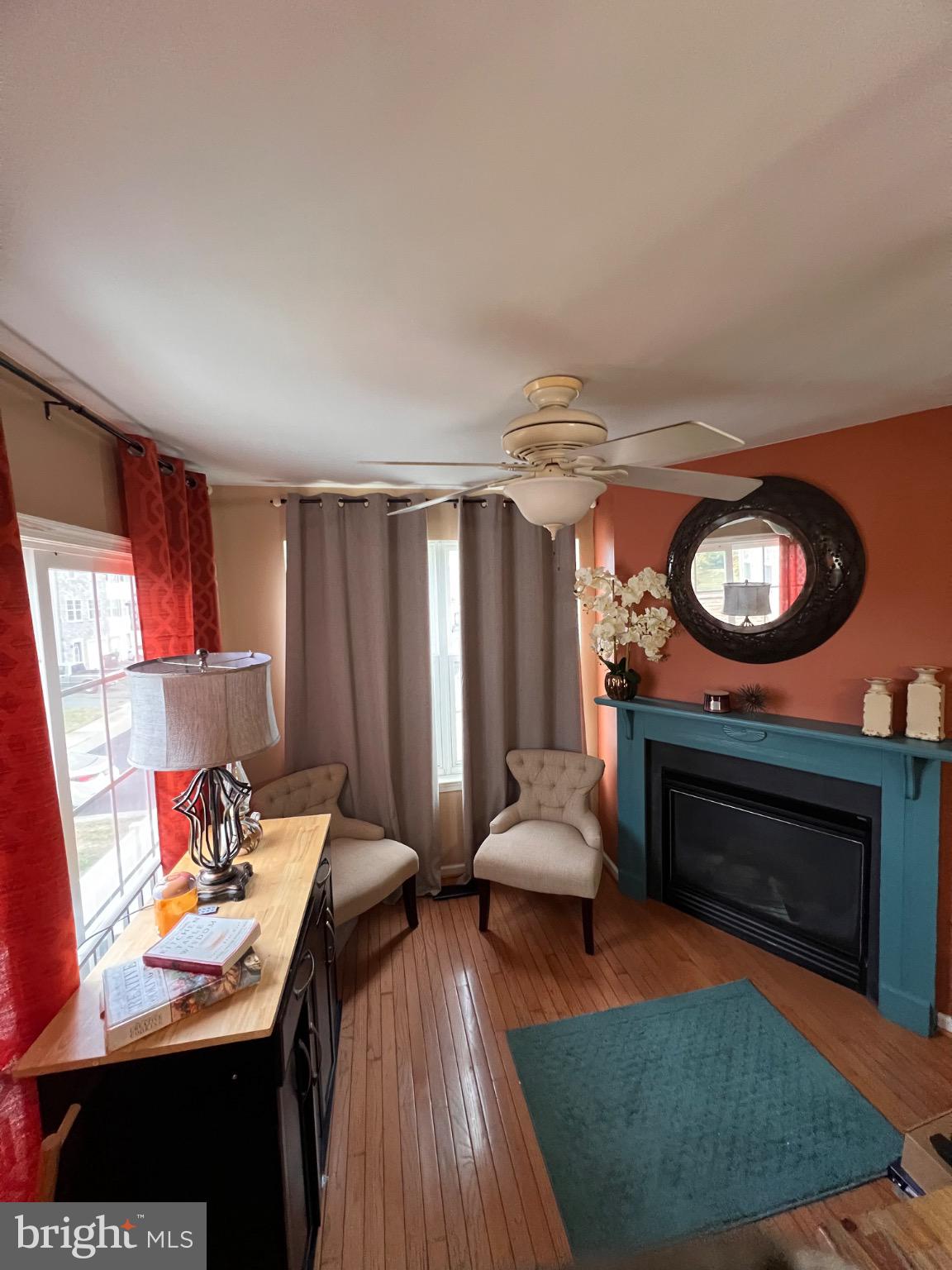 103 Canvasback Way Cambridge, MD 21613 - Photo 16 of 39 a living room with furniture a rug a fireplace and a window