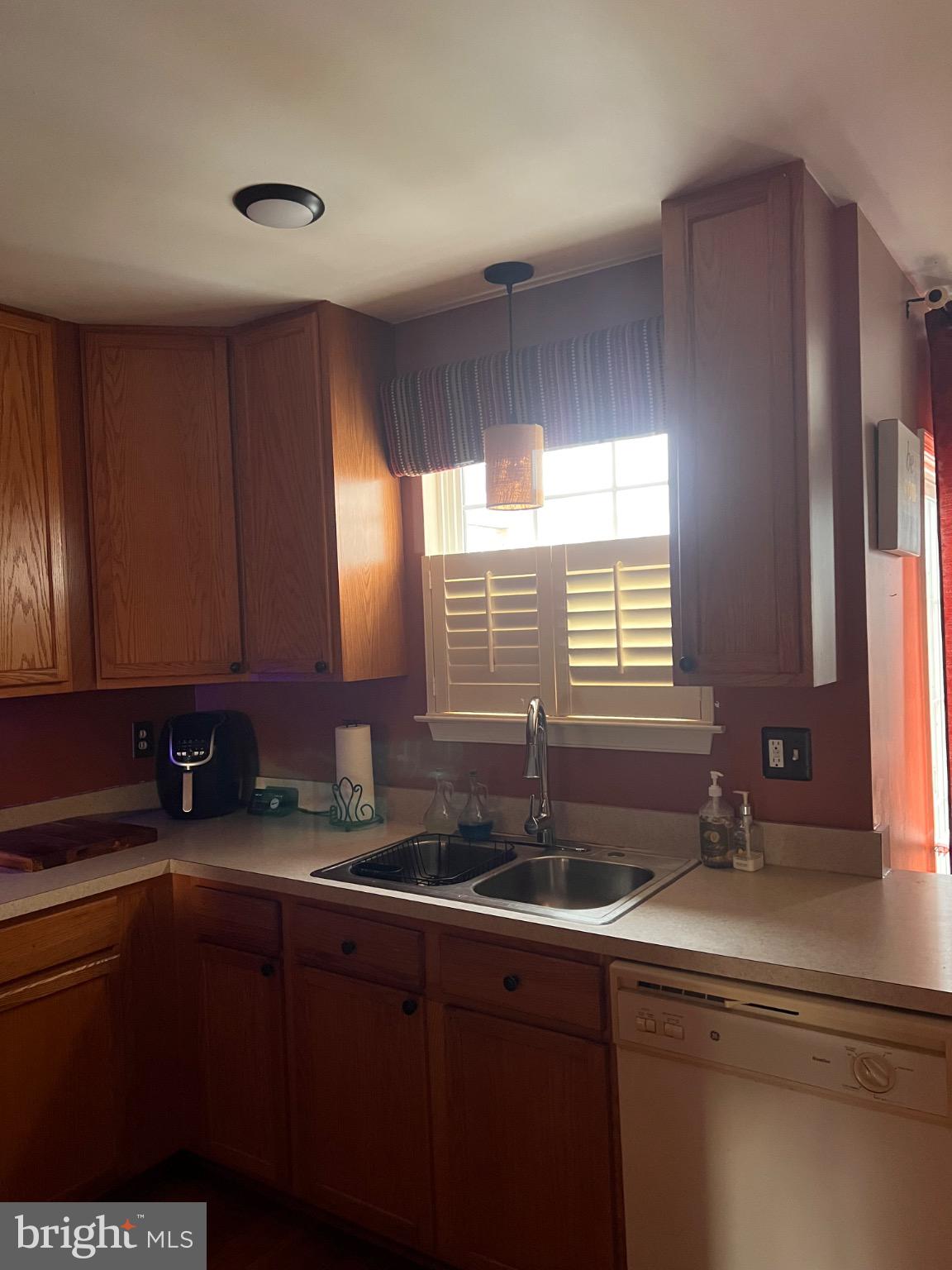 103 Canvasback Way Cambridge, MD 21613 - Photo 20 of 39 a kitchen with a sink and cabinets
