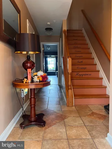 a dining room with furniture and entryway