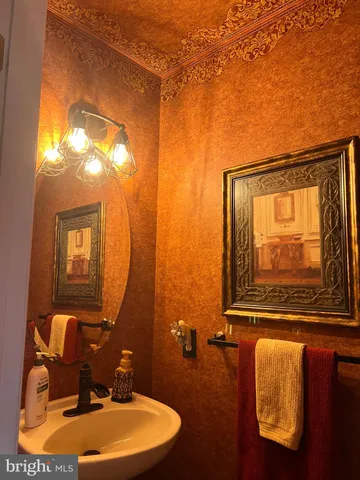 a kitchen with stainless steel appliances granite countertop a sink a stove and refrigerator