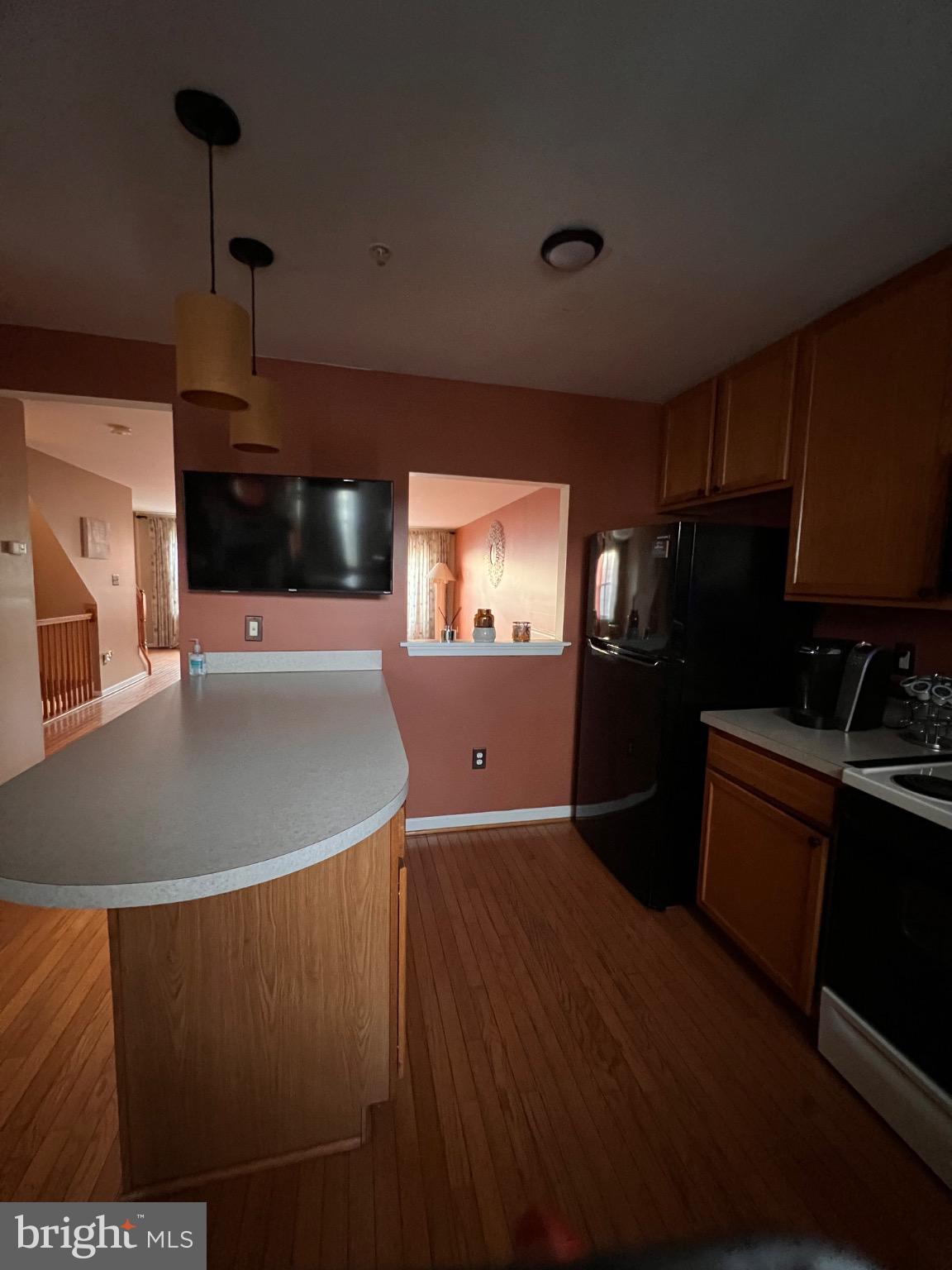 103 Canvasback Way Cambridge, MD 21613 - Photo 23 of 39 a kitchen with stainless steel appliances granite countertop a sink a stove and refrigerator