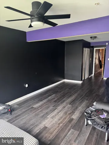 a living room with furniture and windows