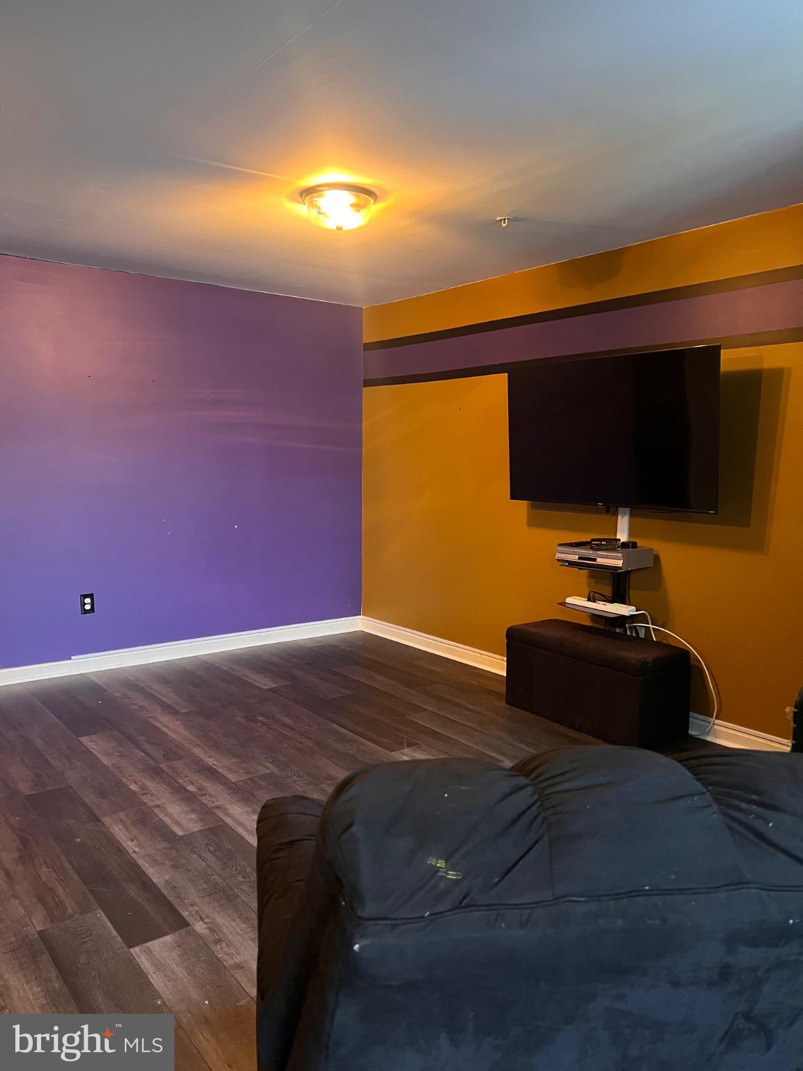 103 Canvasback Way Cambridge, MD 21613 - Photo 4 of 39 a bedroom with a bed and a flat screen tv