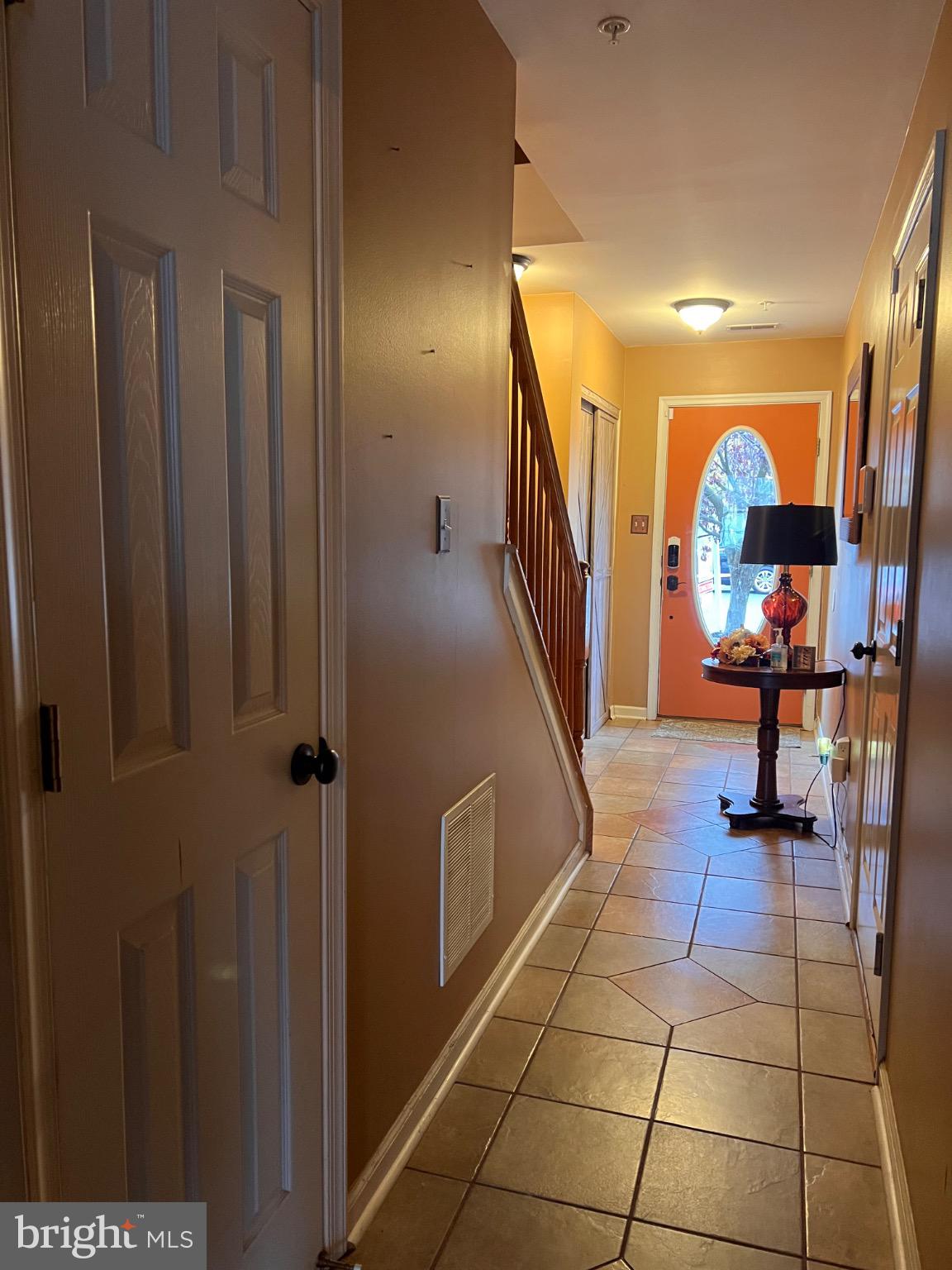 103 Canvasback Way Cambridge, MD 21613 - Photo 6 of 39 a view of a entryway door with a rug
