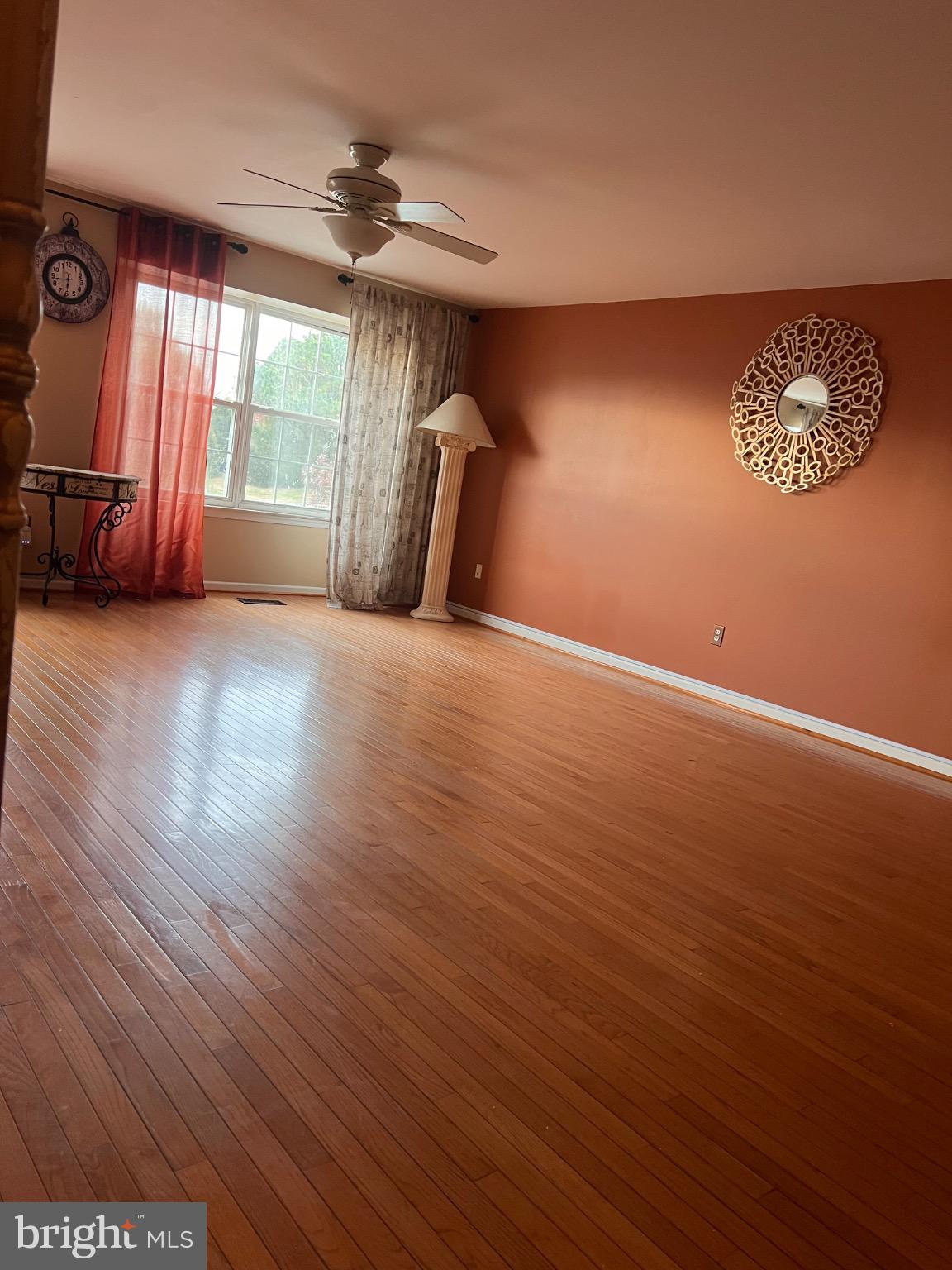 103 Canvasback Way Cambridge, MD 21613 - Photo 9 of 39 an empty room with wooden floor and windows