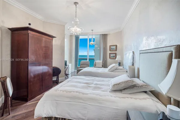 a bedroom with double bed and a window