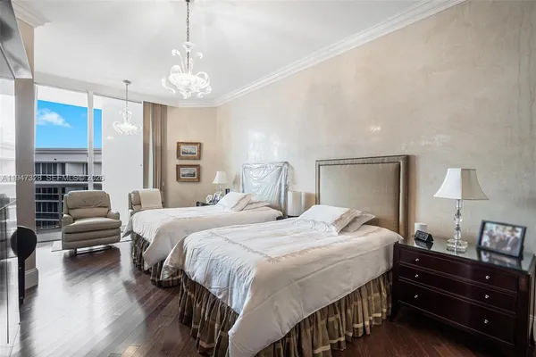 a bedroom with bed and window