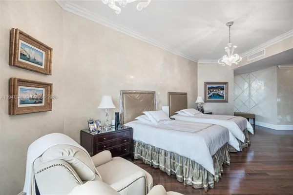 a bedroom with a bed couch and a window