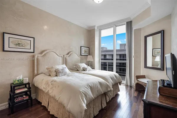 a bedroom with bed and a window