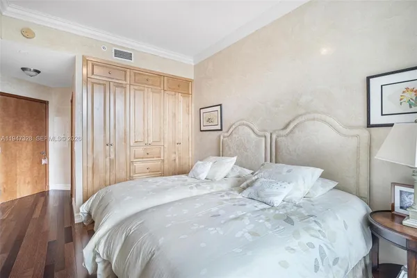 a bedroom with a bed and a closet