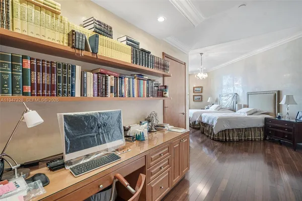 a bedroom with furniture and a window