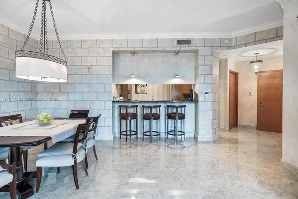 a dining room with a table and chairs