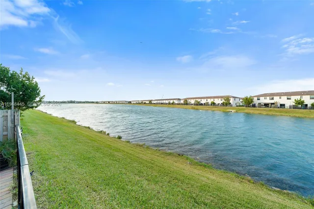 a view of a house with a backyard and a patio