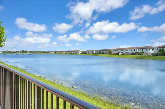 a view of a lake with a city in the background