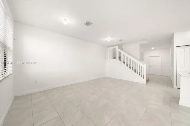 an empty room with windows