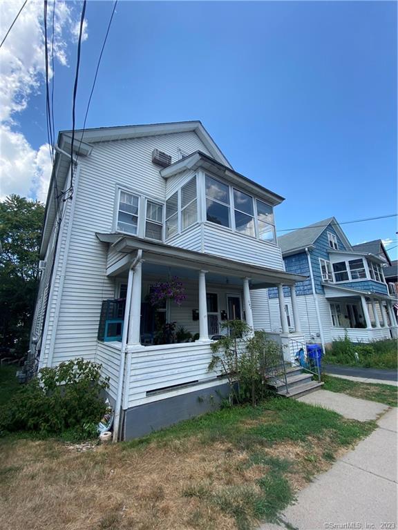 140 Grand Street, Unit 3 Middletown, CT 06457 - Photo 1 of 1 a front view of a house with a yard